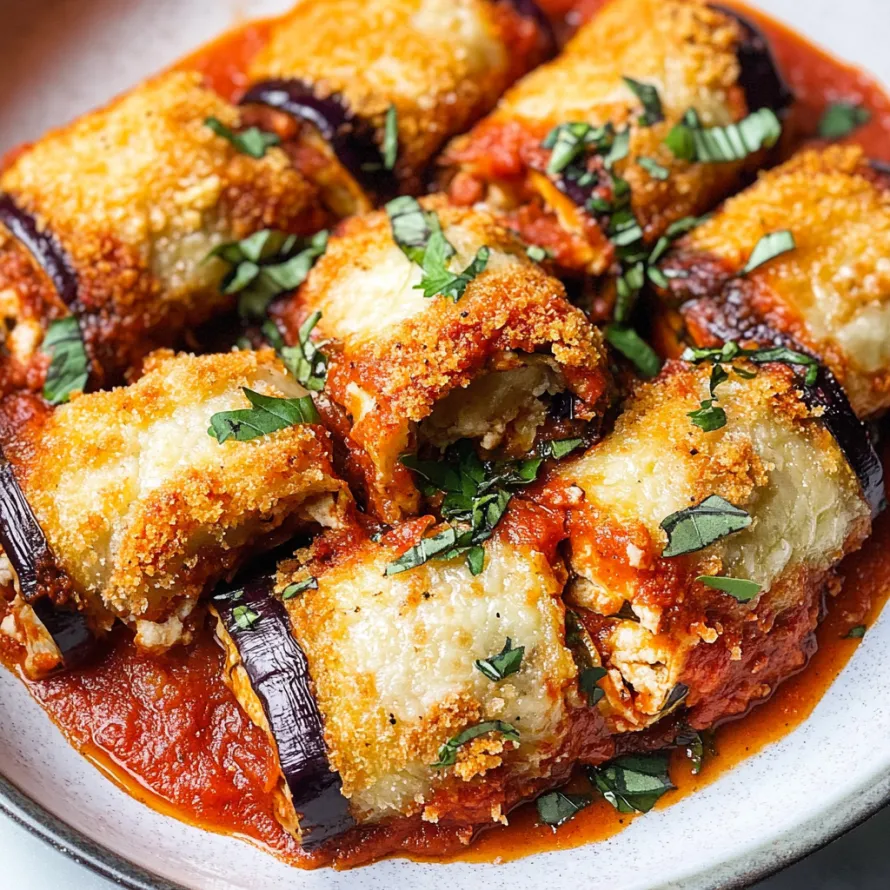 Golden crispy eggplant rolls with marinara.