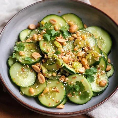 A close-up of cucumber slices topped with nuts.
