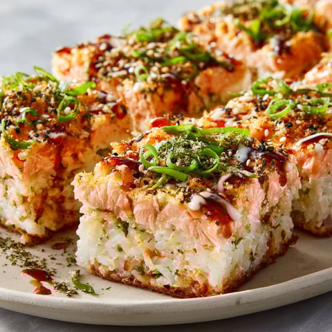 A plate of sushi with salmon and rice.
