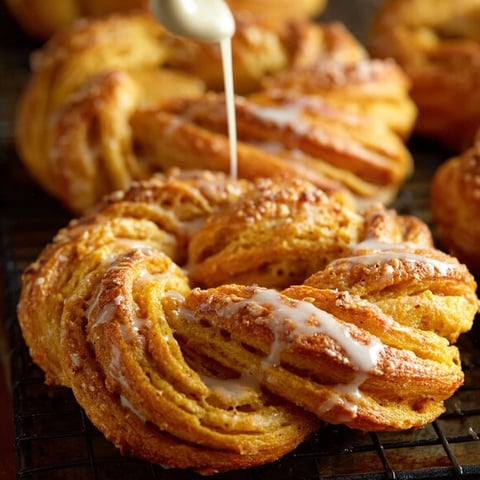 Pumpkin twists with icing drizzled on top.